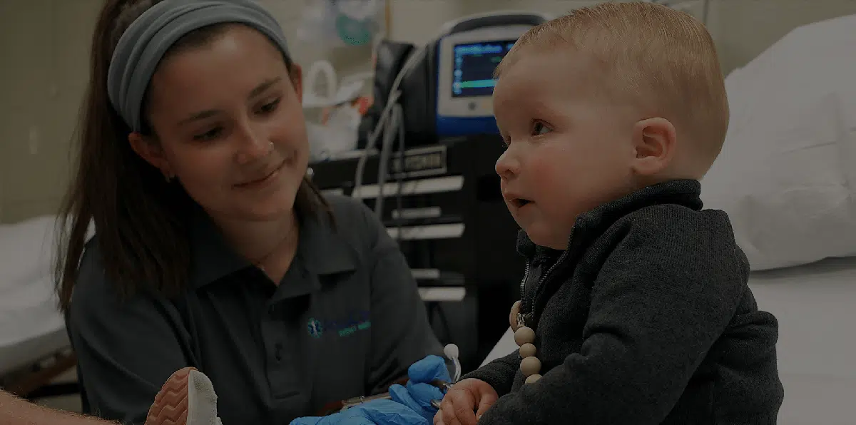Advertisement for event medical care showing a close-up of a medical professional with a baby